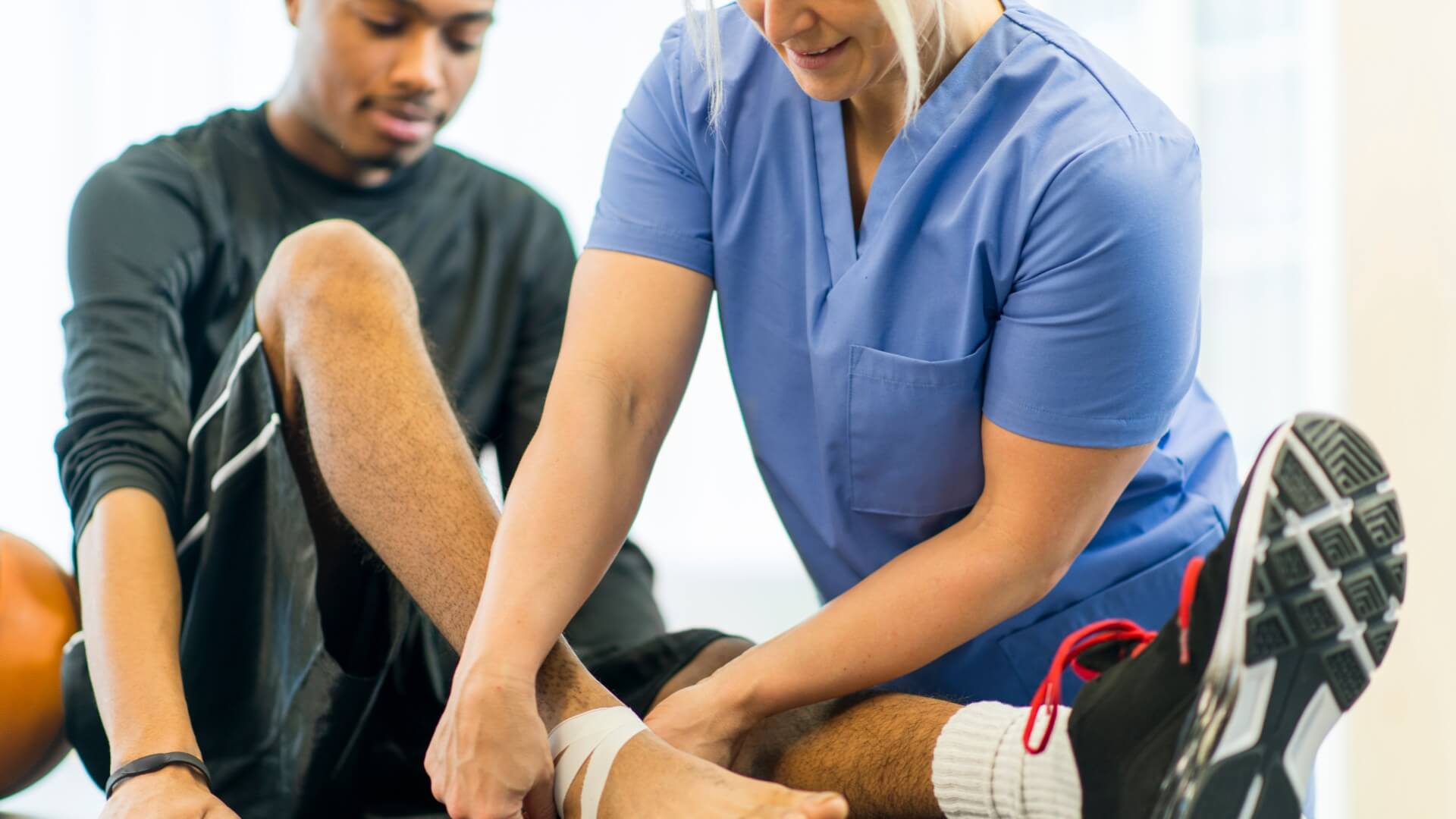 Man working on ankle with physiotherapist