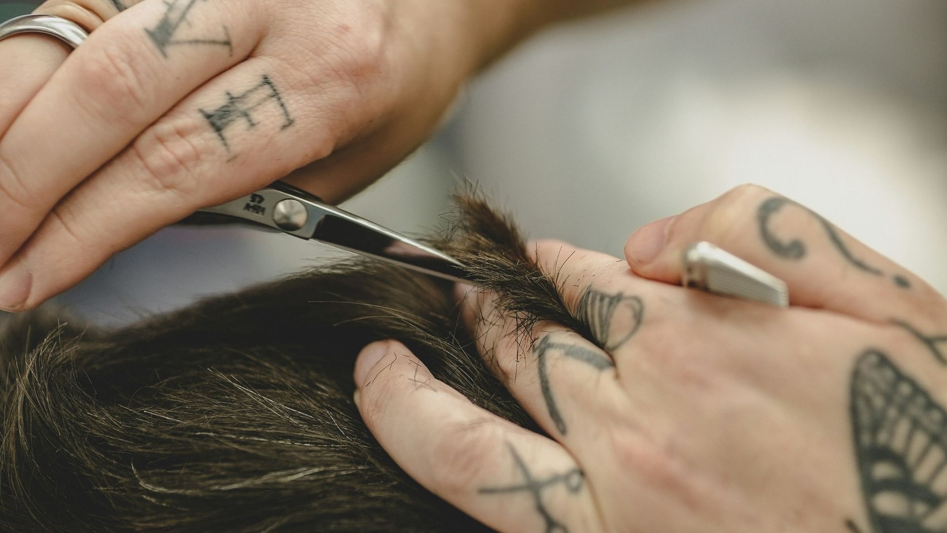 Close up of barber shaving head