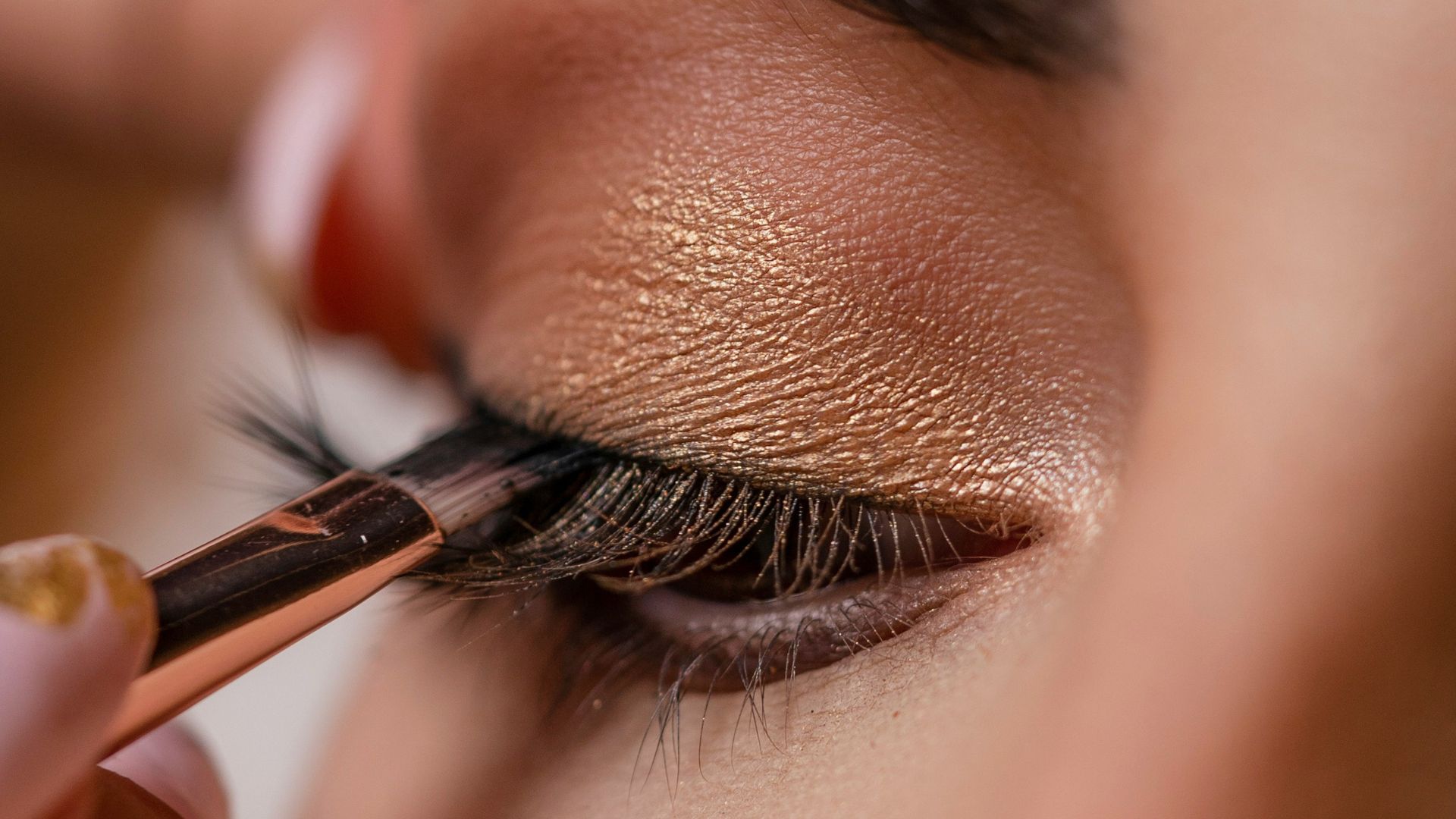 Close up of eyeshadow being applied to woman