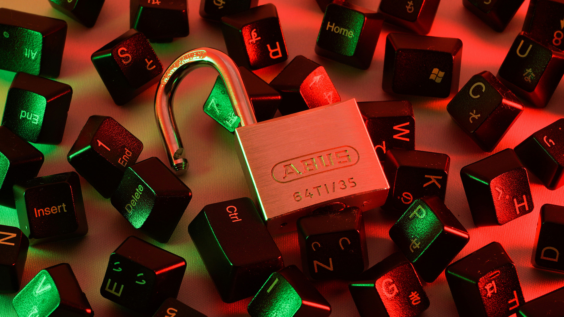 Unlocked padlock surrounded by keyboard keys