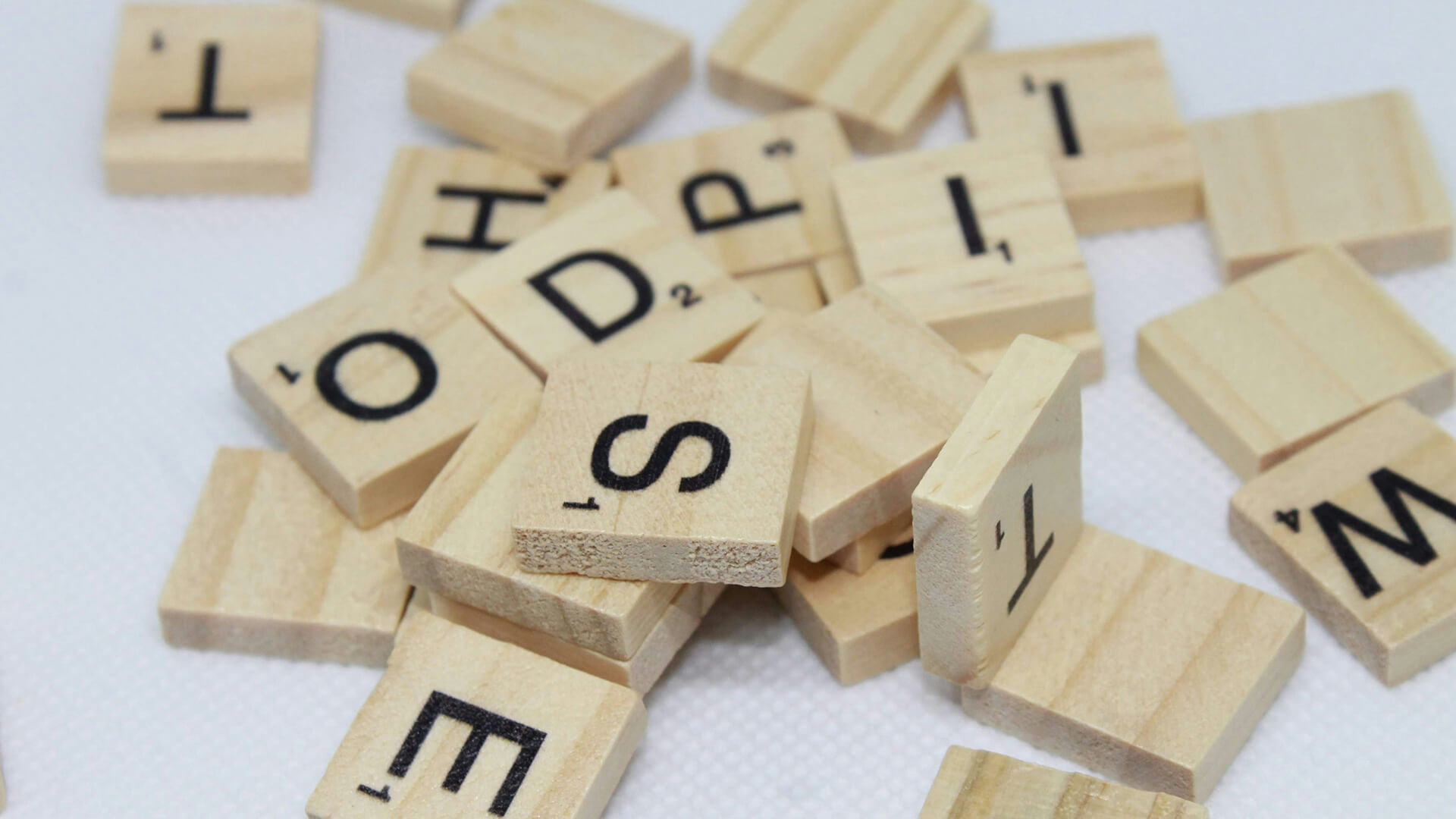 A variety of pink letter fridge magnets.