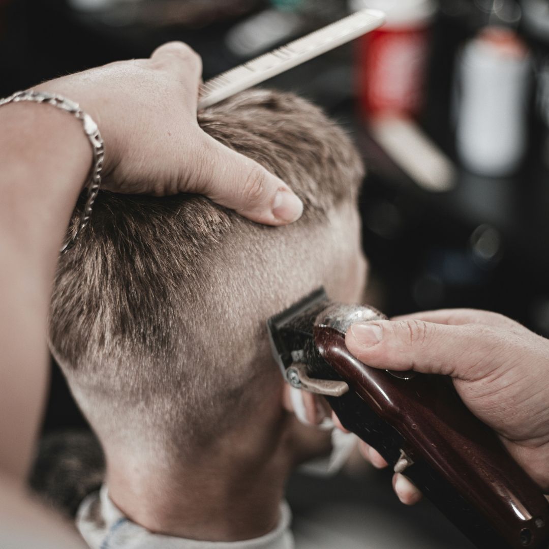 Close up of barber shaving head