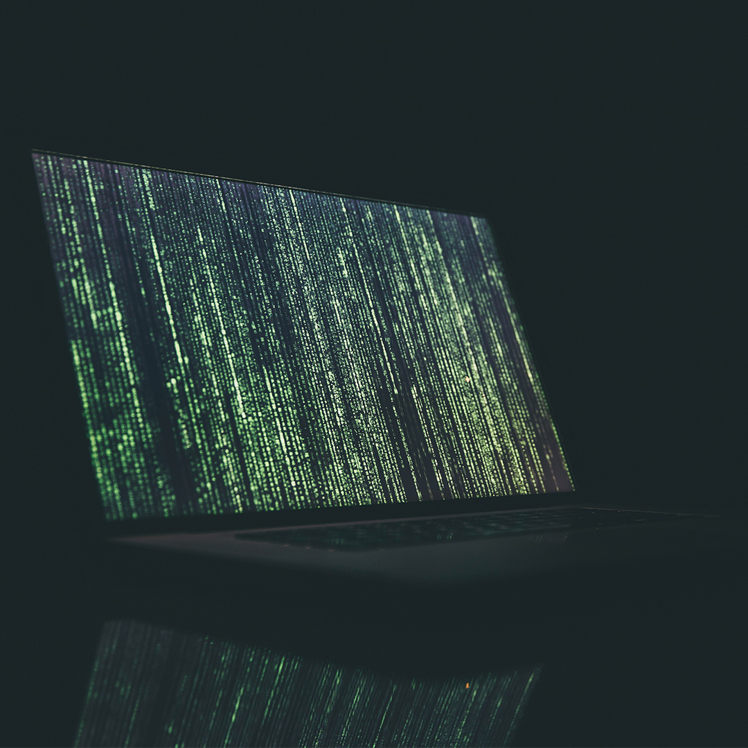 Laptop with coding on screen