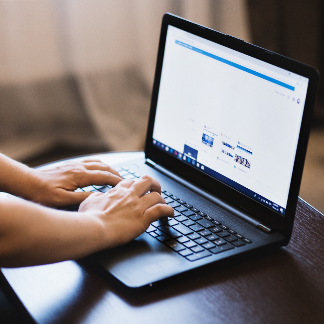 Person using laptop.