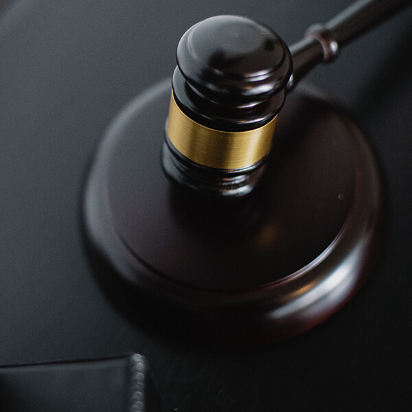 A Judges gavel on a desk.