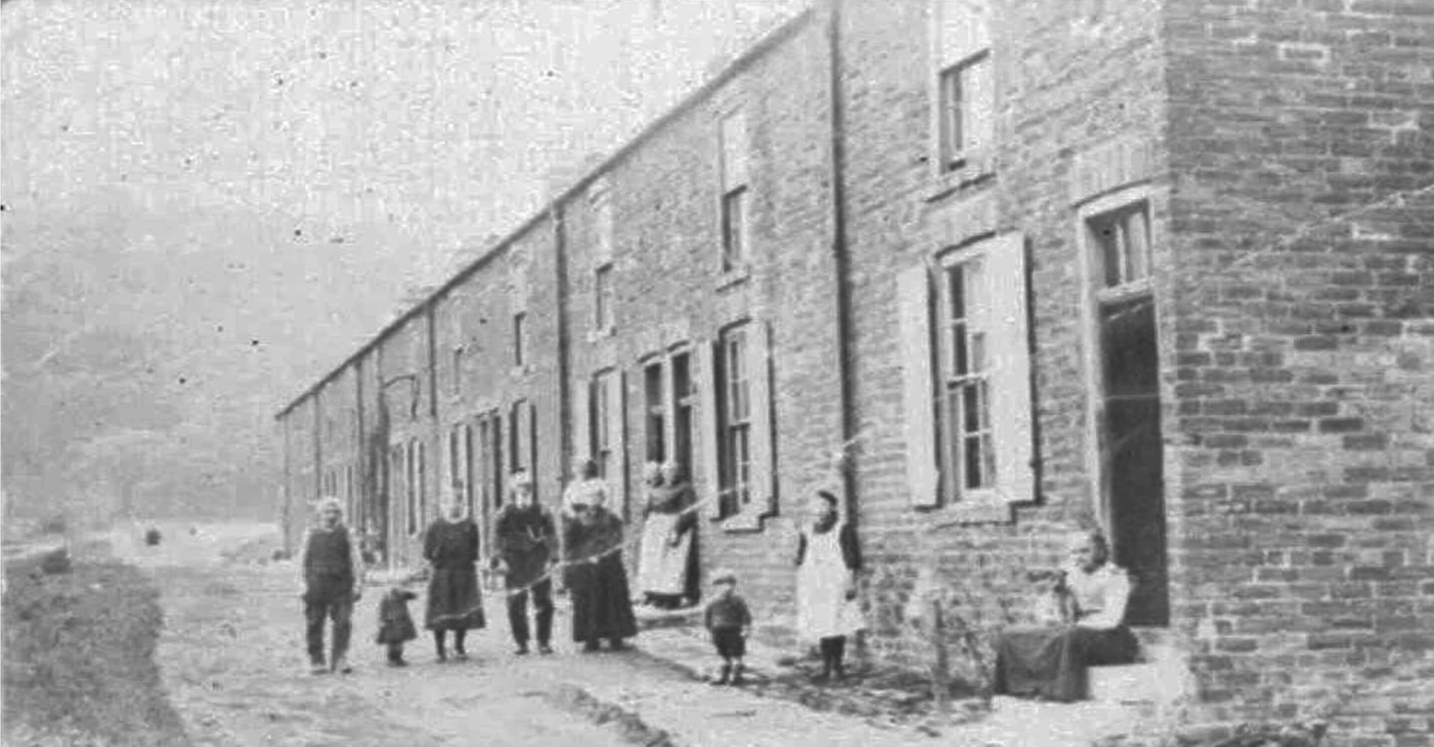 Black and white photo of Houghall Colliery Terrace Houses from 1800s with some residents on Cross Street