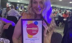 Faye Carr Holding An Award