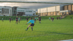 Football match taken from behind goal