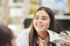Student smiling at person off-camera