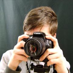 Person holding camera up to eye
